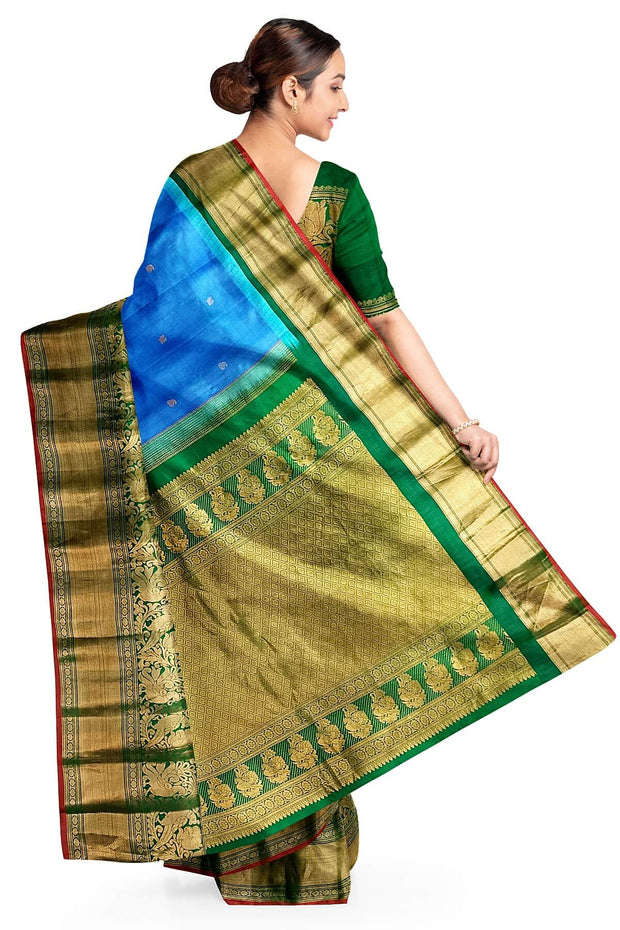 Gadwal pure silk saree in blue with peacock motifs in gold & silver.