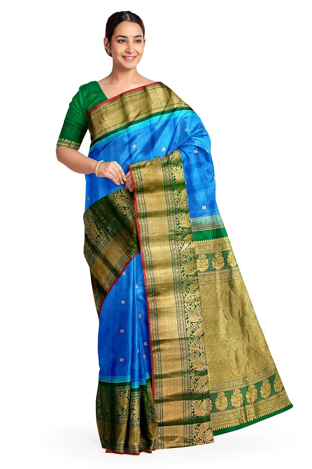 Gadwal pure silk saree in blue with peacock motifs in gold & silver.