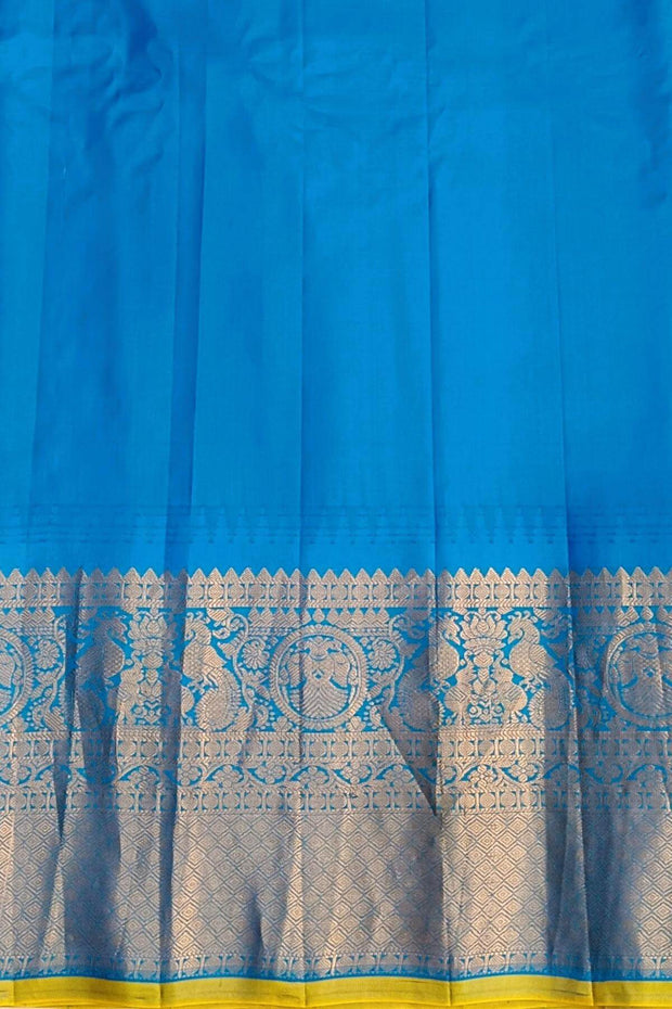 Gadwal pure silk saree in sea blue with   disc motif in gold & silver.
