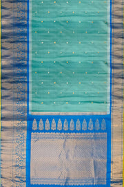 Gadwal pure silk saree in sea blue with   disc motif in gold & silver.