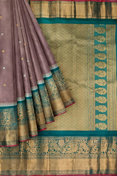 Gadwal pure silk saree in  chickoo with  peacock & floral motif in gold & silver.