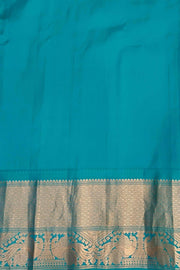 Gadwal pure silk saree in Berry blue with  peacock & floral motifs in gold .