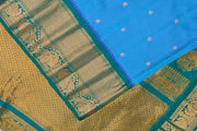 Gadwal pure silk saree in Berry blue with  peacock & floral motifs in gold .