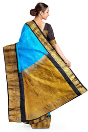 Gadwal pure silk saree in copper sulphate blue with  peacock &  disc  motif in gold.