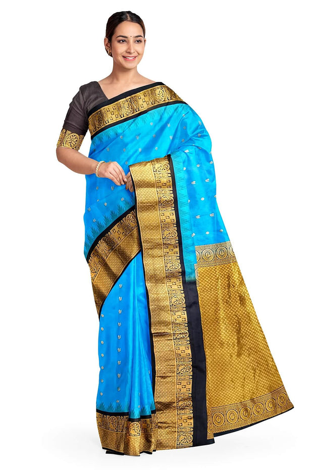 Gadwal pure silk saree in copper sulphate blue with  peacock &  disc  motif in gold.