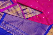 Gadwal pure silk saree in  pink   with  peacock & disc motif in gold & silver.