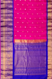 Gadwal pure silk saree in  pink   with  peacock & disc motif in gold & silver.