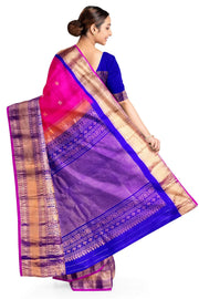 Gadwal pure silk saree in  pink   with  peacock & disc motif in gold & silver.