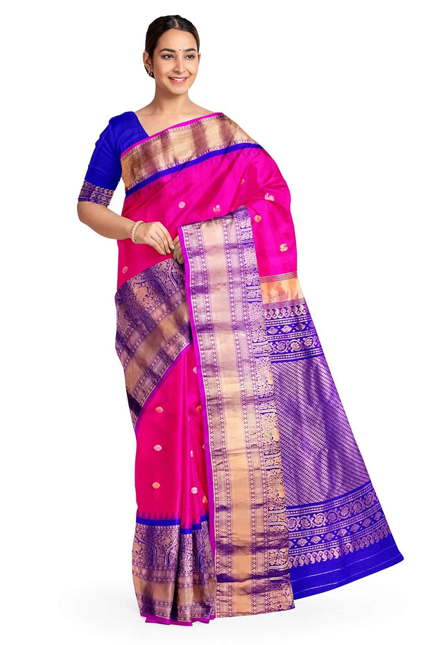 Gadwal pure silk saree in  pink   with  peacock & disc motif in gold & silver.