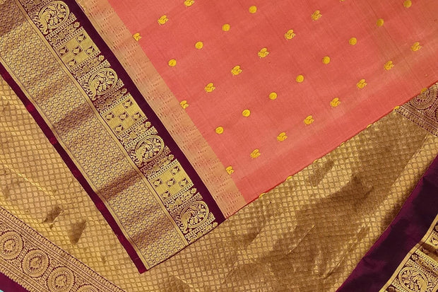 Gadwal pure silk saree in honey with  peacock & disc motif in gold.