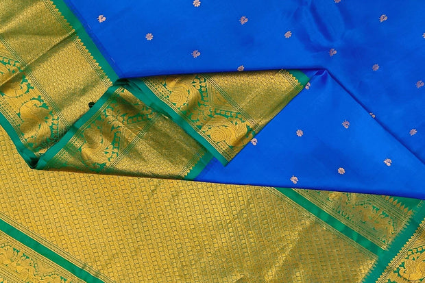 Gadwal pure silk saree in  blue with  peacock & floral motif in gold & silver.