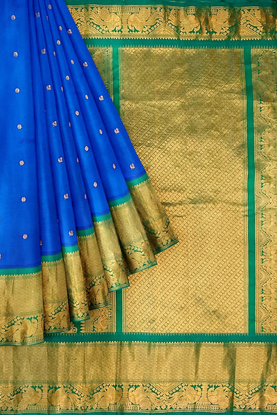 Gadwal pure silk saree in  blue with  peacock & floral motif in gold & silver.