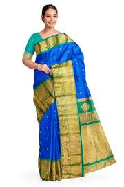 Gadwal pure silk saree in  blue with  peacock & floral motif in gold & silver.