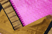 Gadwal pure silk saree in pink with  peacock &  disc  motif in gold.