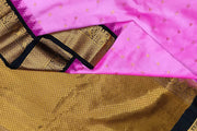 Gadwal pure silk saree in pink with  peacock &  disc  motif in gold.