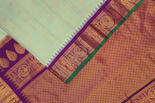 Gadwal pure silk saree in light pista green in fine checks
