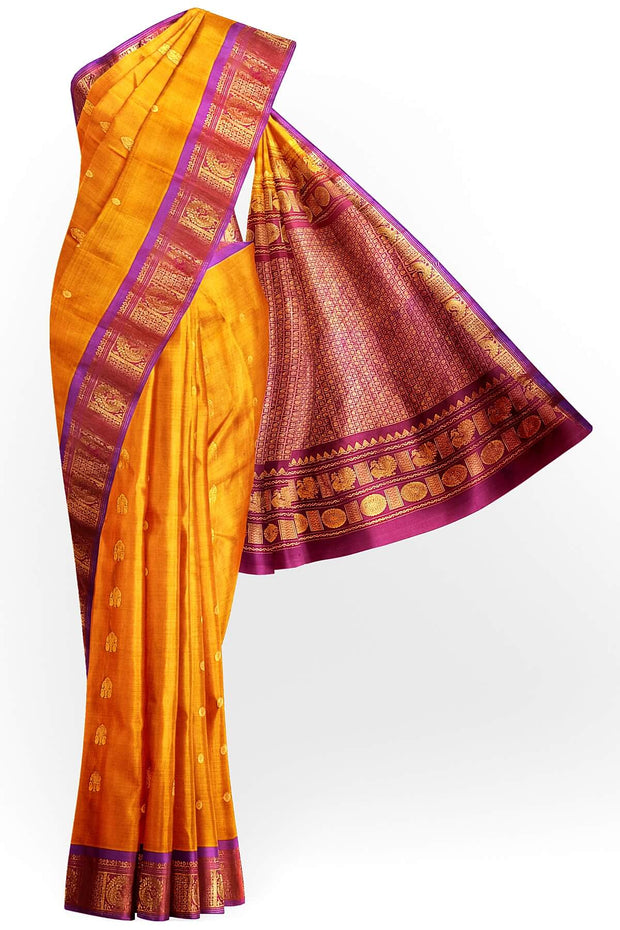 Handwoven Gadwal pure silk saree in mustard with small buttis on the body .