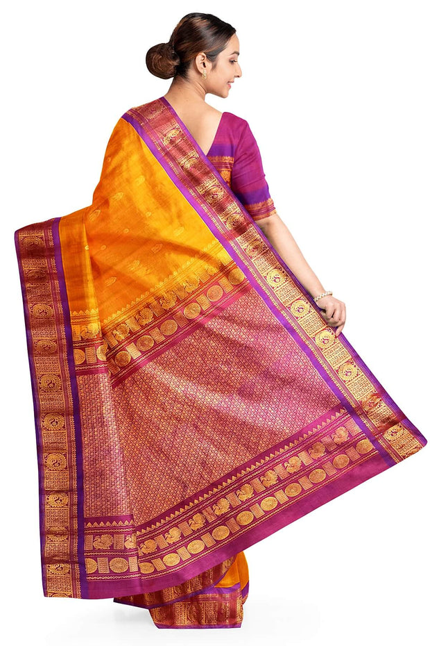 Handwoven Gadwal pure silk saree in mustard with small buttis on the body .