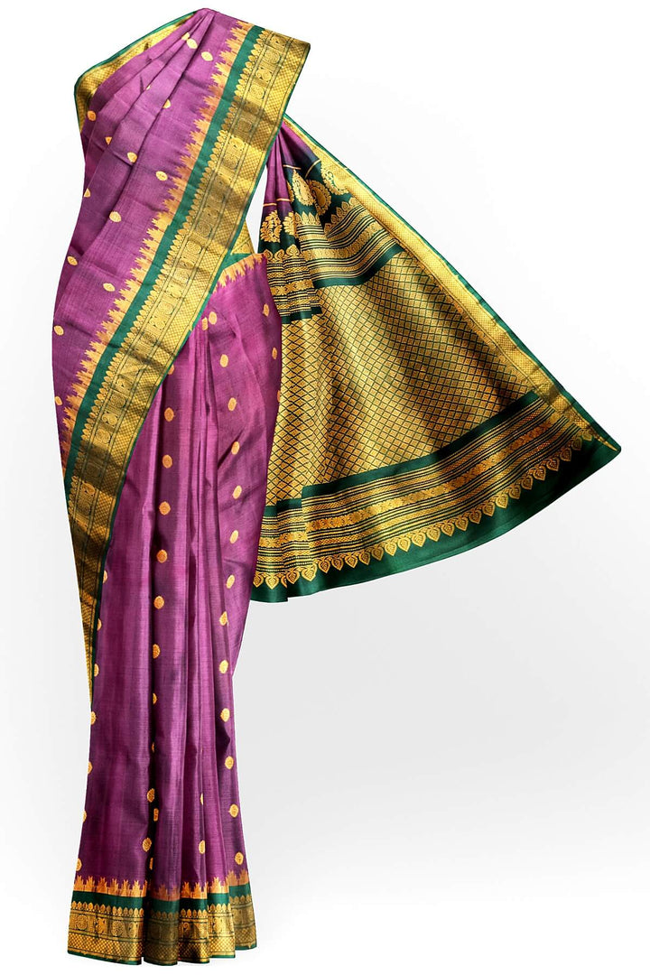 Handwoven Gadwal pure silk saree in  wine with small buttis on the body .