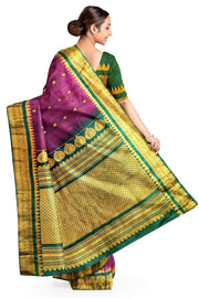 Handwoven Gadwal pure silk saree in  wine with small buttis on the body .