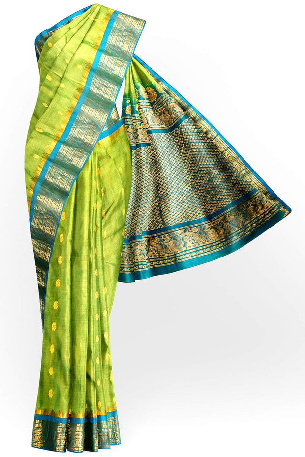 Handwoven Gadwal pure silk saree in  green with small buttis on the body .
