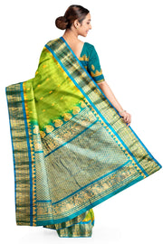 Handwoven Gadwal pure silk saree in  green with small buttis on the body .