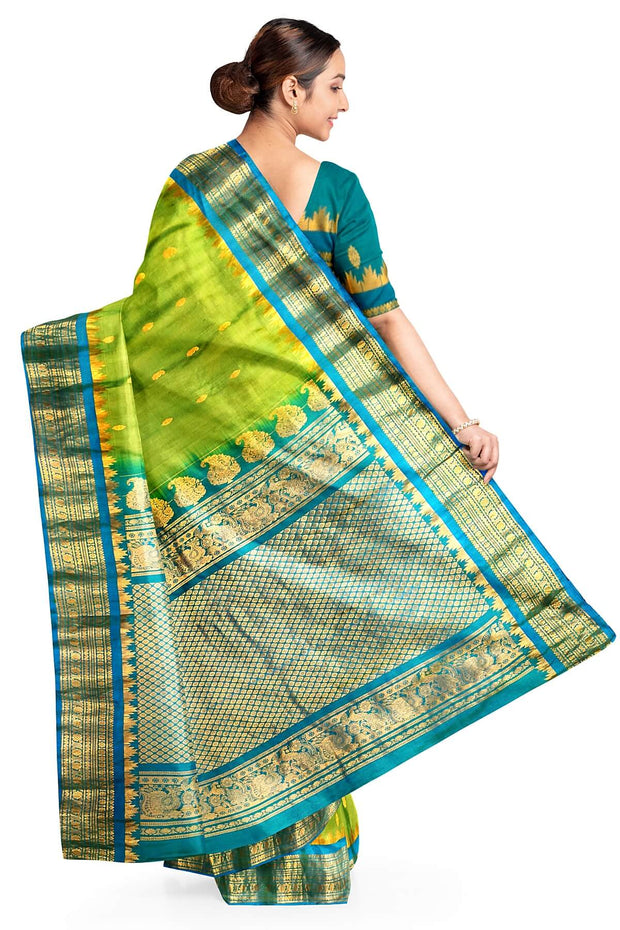 Handwoven Gadwal pure silk saree in  green with small buttis on the body .