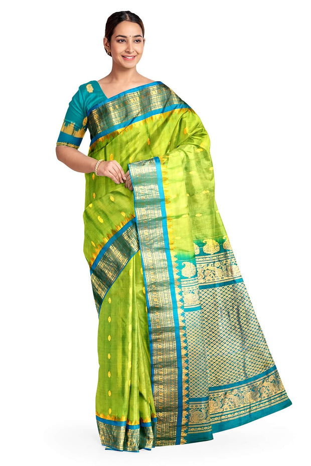 Handwoven Gadwal pure silk saree in  green with small buttis on the body .