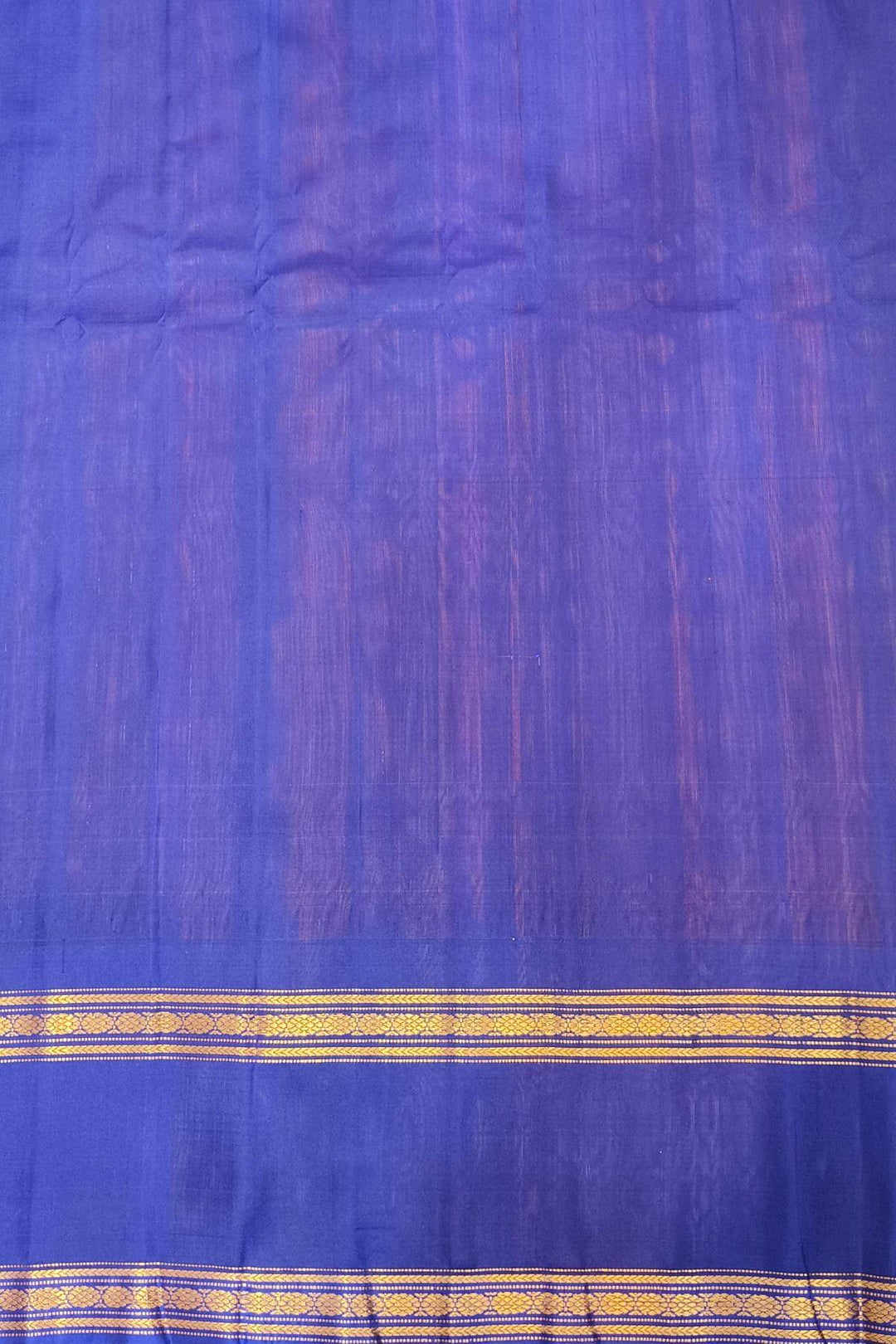 Gadwal pure silk saree in orange with stripes.