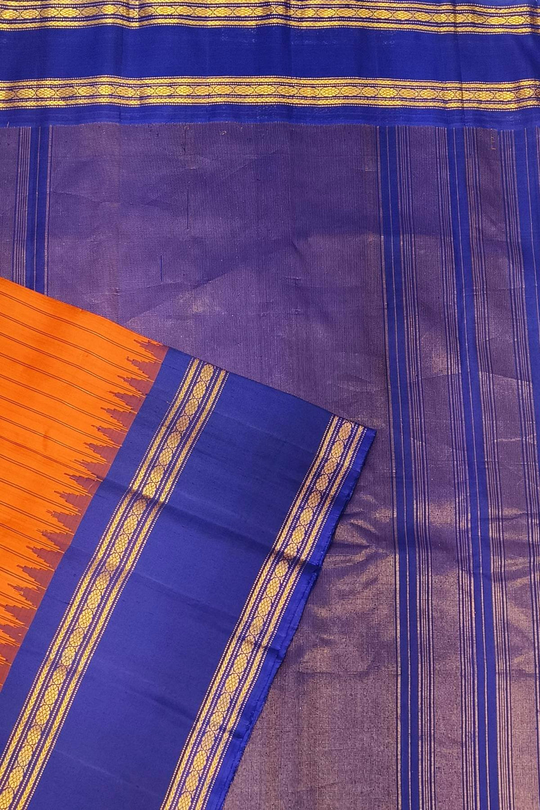 Gadwal pure silk saree in orange with stripes.