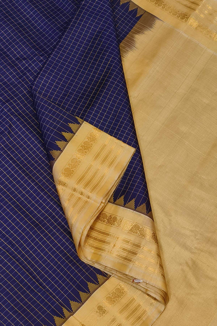 Gadwal pure silk saree in violet with checks.