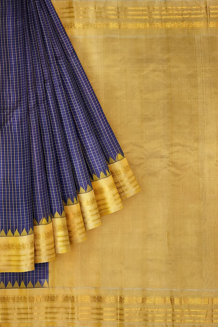 Gadwal pure silk saree in violet with checks.
