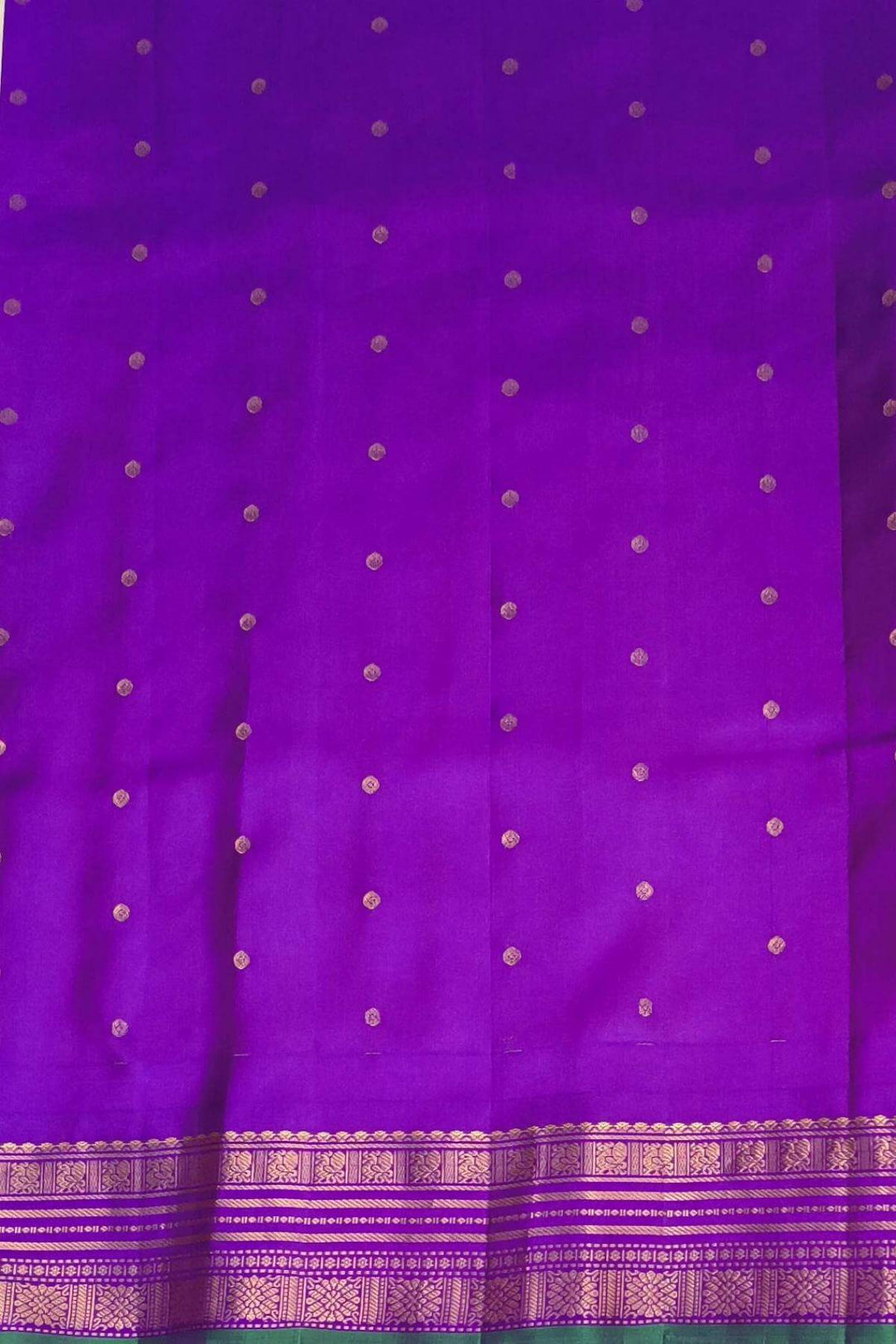 Gadwal pure silk saree with buttis & stripes.