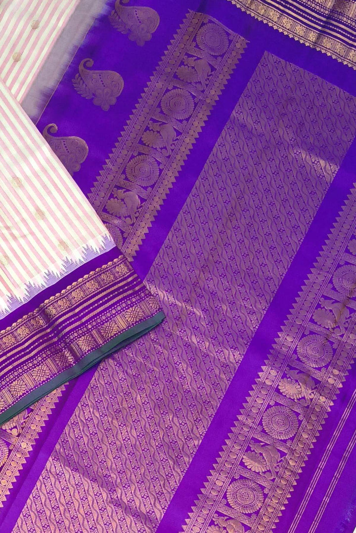 Gadwal pure silk saree with buttis & stripes.