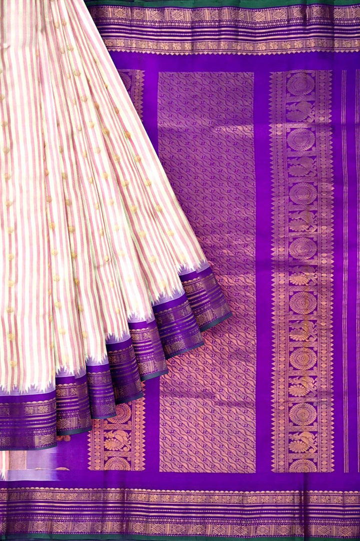 Gadwal pure silk saree with buttis & stripes.