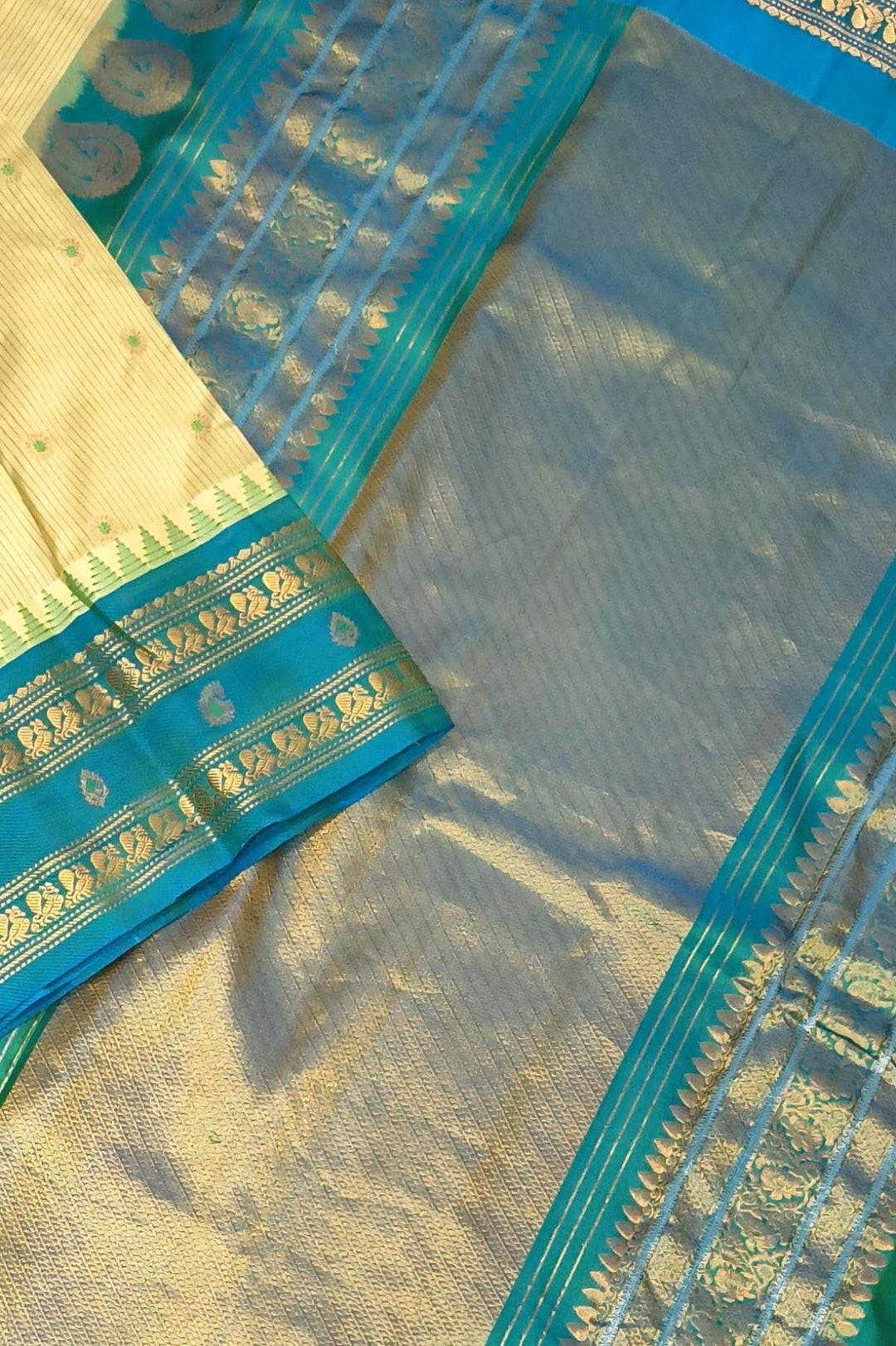 Gadwal pure silk saree with meena buttis & stripes.