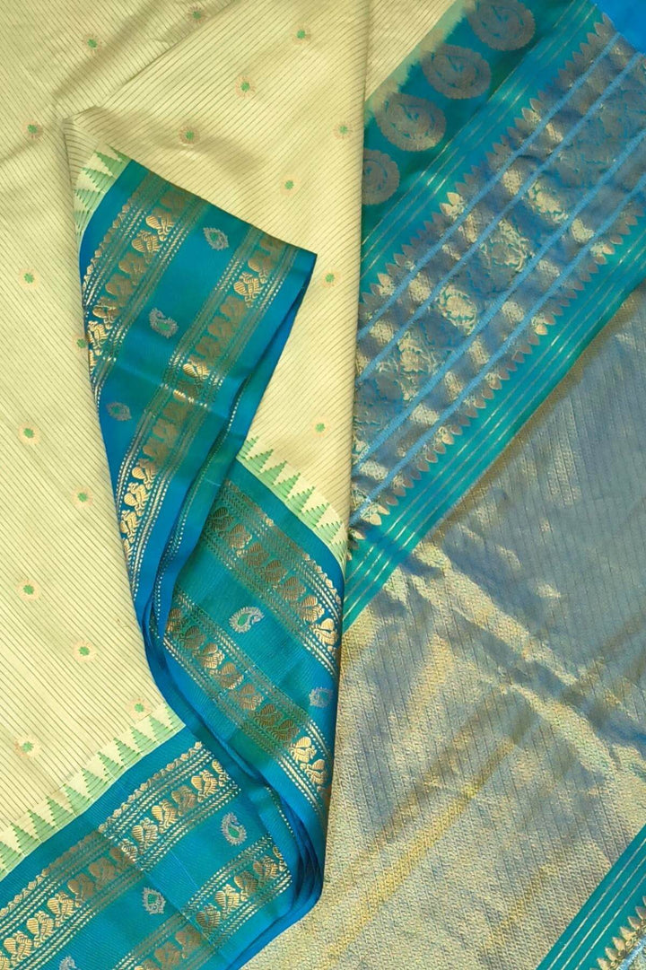Gadwal pure silk saree with meena buttis & stripes.