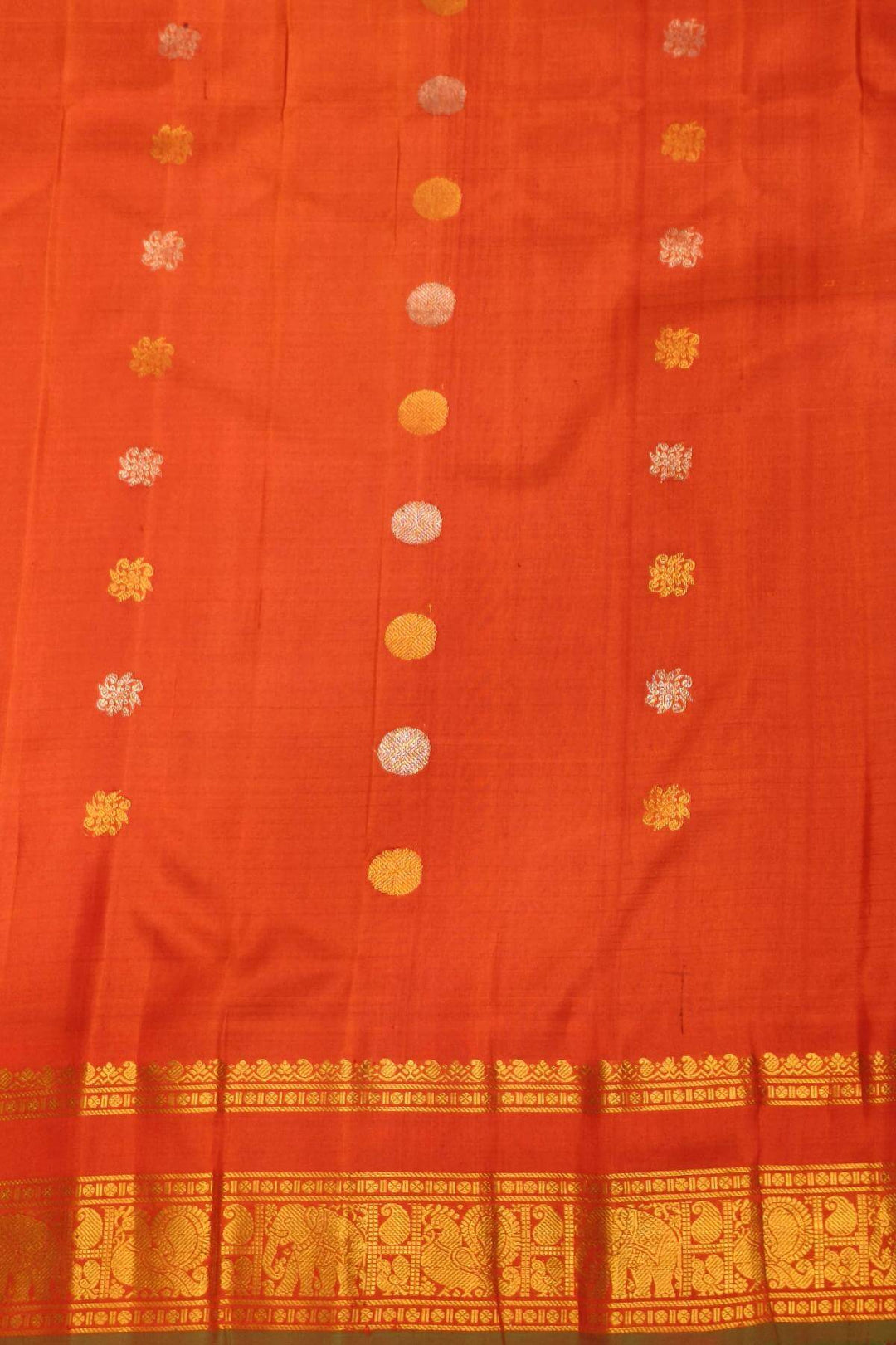 Gadwal pure silk saree in brown in fine checks  with  gold & silver buttis
