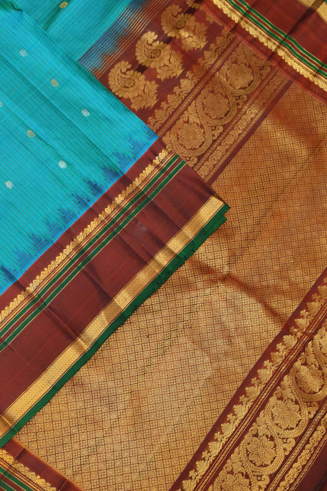 Gadwal pure silk saree in ananda blue in fine checks  with  gold & silver  buttis