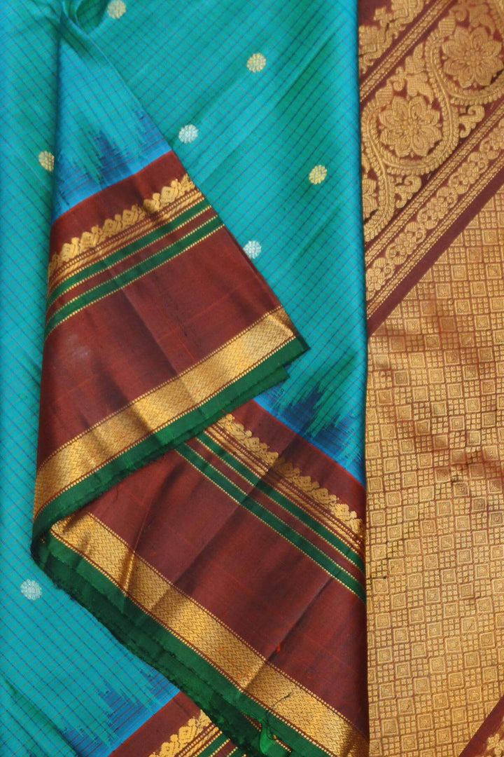 Gadwal pure silk saree in ananda blue in fine checks  with  gold & silver  buttis
