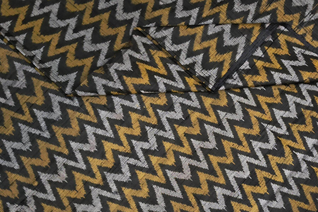 Handwoven Ikat pure silk fabric in black in zig zag pattern in dupion finish