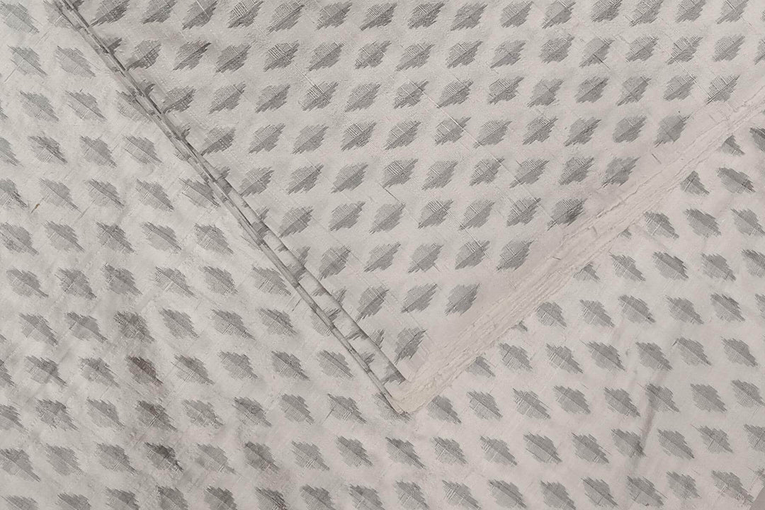 Handwoven Ikat pure silk fabric in  off white in dupion finish