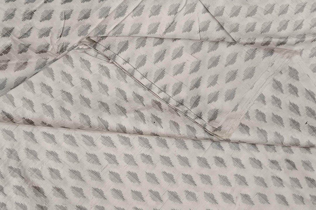 Handwoven Ikat pure silk fabric in  off white in dupion finish