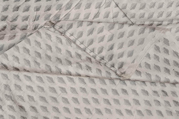 Handwoven Ikat pure silk fabric in  off white in dupion finish