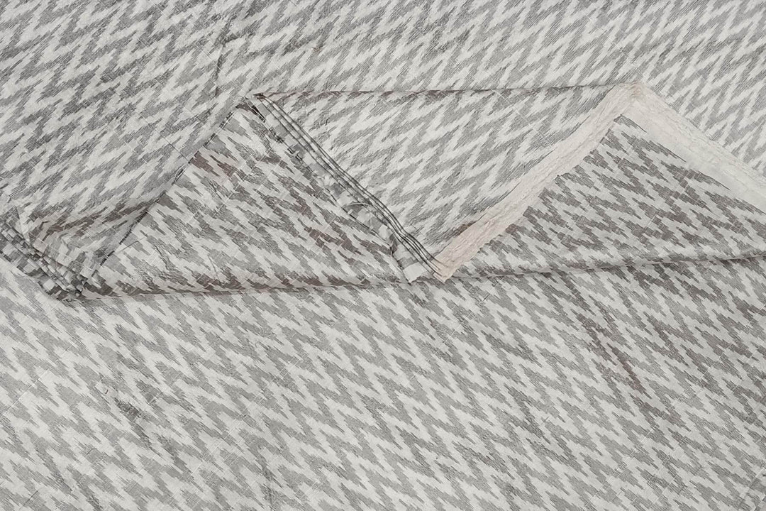 Handwoven Ikat pure silk fabric in off white in zig zag pattern in dupion finish
