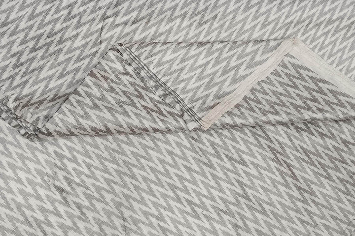 Handwoven Ikat pure silk fabric in off white in zig zag pattern in dupion finish
