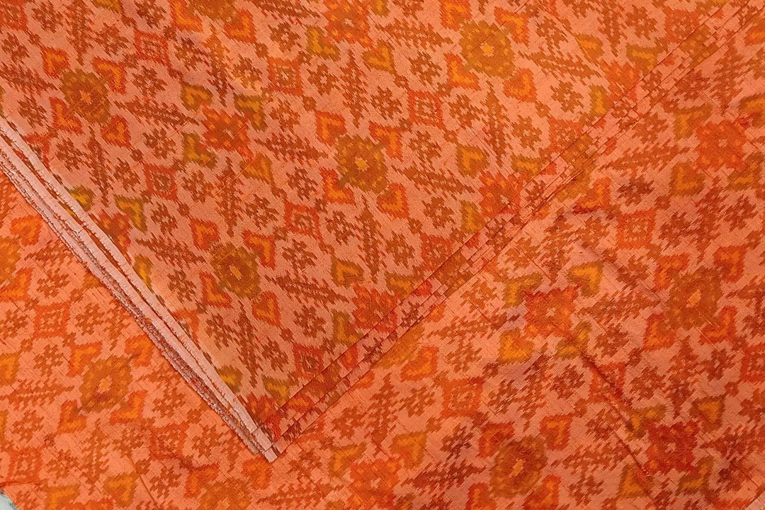 Handwoven Ikat pure silk fabric in orange in dupion finish