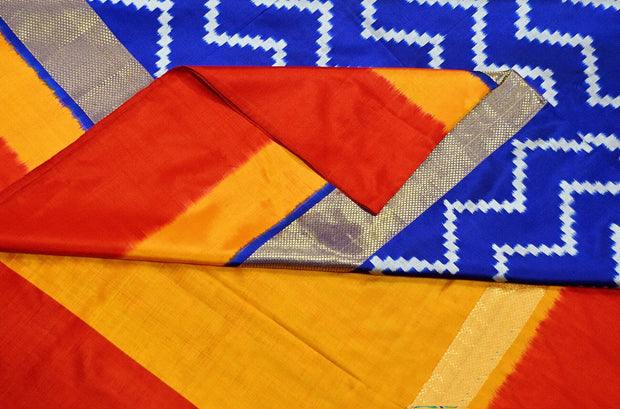 Ikat pure silk saree in blue in zigzag pattern and a zari border with  contrast pallu