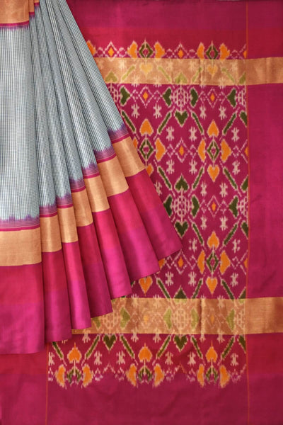 Handwoven Ikat pure silk saree in blue in  fine checks with a contrast pallu