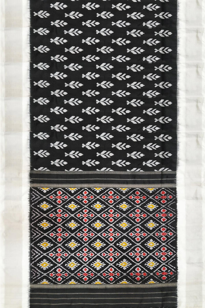 Ikat pure silk saree in black with floral motifs  and silver borders.